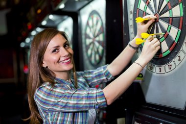 depositphotos_79184836-stock-photo-woman-playing-darts-in-a.jpg