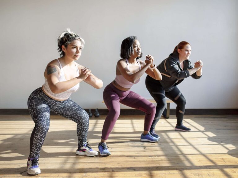 women-doing-squats-in-fitness-class-2023-11-27-05-31-33-utc-scaled.jpg