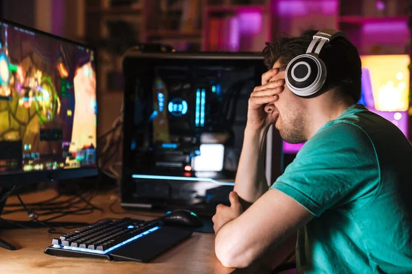 depositphotos_404163078-stock-photo-image-unhappy-young-man-headphones.webp.webp