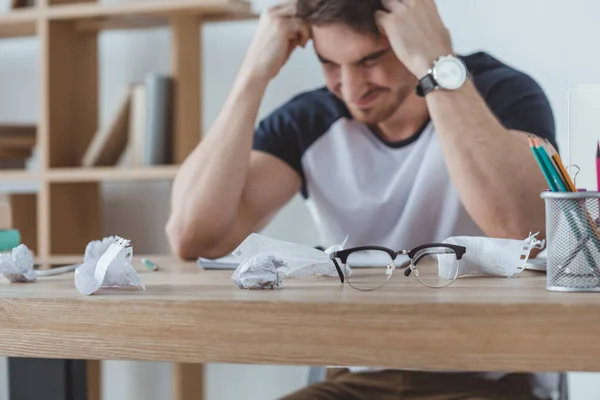 depositphotos_189611176-stock-photo-depressed-student-studying-table-crumpled.webp.webp