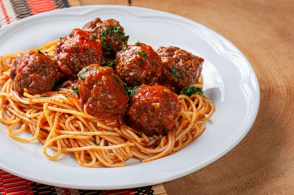 depositphotos_395509370-stock-photo-meatballs-tomato-sauce-pasta-almondegas-1.webp.webp