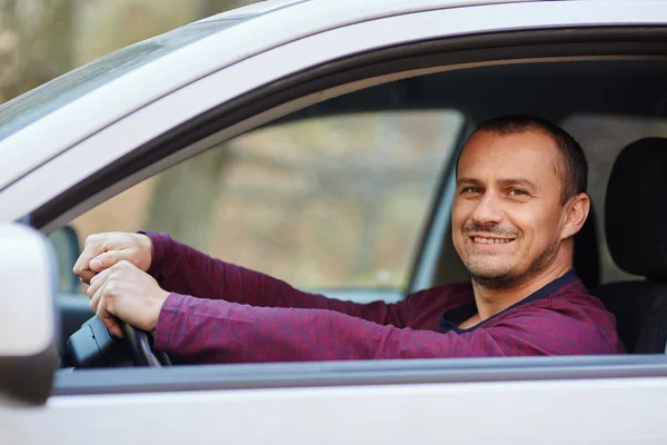 depositphotos_90991706-stock-photo-happy-man-behind-the-wheel.webp.webp